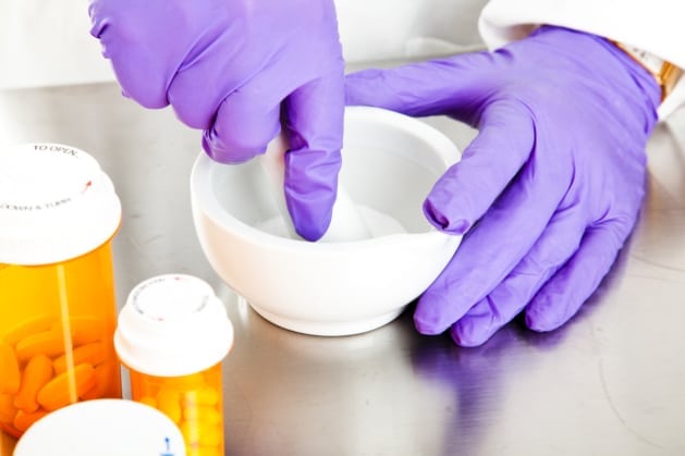 a pharmacist compounding medication